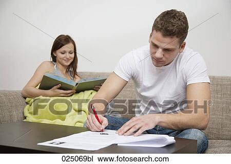 Stock Image - young couple at home. Fotosearch
