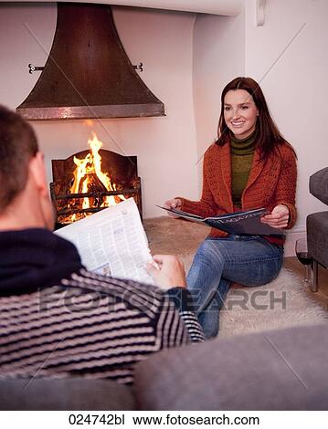 young woman sitting on floor at home beside chimney View Large Photo Image Stock Image - young woman sitting on floor at home beside chimney. Fotosearch