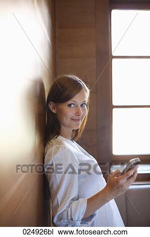 young woman with mobile phone View Large Photo Image Stock Image - young woman with mobile phone. Fotosearch
