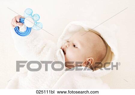 Stock Image - baby boy with teething ring. Fotosearch