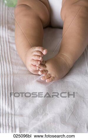 Stock Image - close-up of baby´s feet. Fotosearch