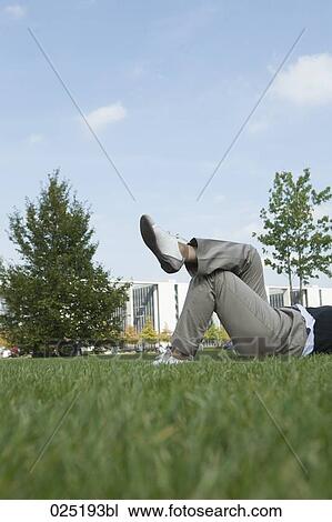 detail of woman relaxing in grass View Large Photo Image Stock Image - detail of woman relaxing in grass. Fotosearch