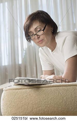 mature woman reading at home View Large Photo Image Stock Image - mature woman reading at home. Fotosearch