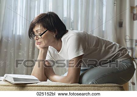 mature woman reading at home View Large Photo Image Stock Image - mature woman reading at home. Fotosearch