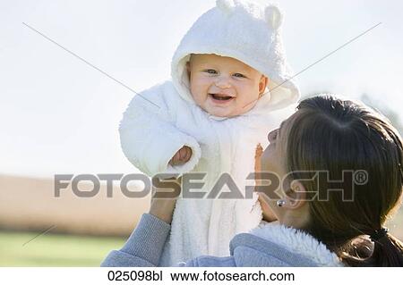 mother holding her baby View Large Photo Image Stock Image - mother holding her baby. Fotosearch