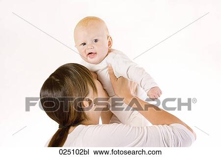 Stock Image - mother playing with her baby. Fotosearch