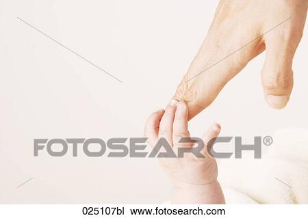 Stock Image - mother´s and baby´s hand touching. Fotosearch