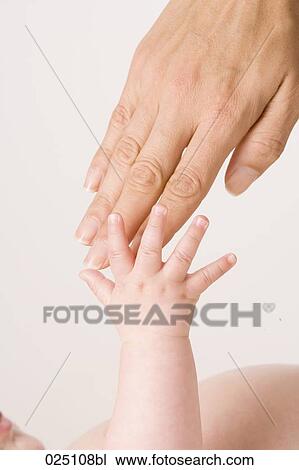 mother´s and baby´s hand touching View Large Photo Image Stock Image - mother´s and baby´s hand touching. Fotosearch