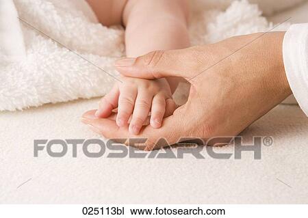 mother´s and baby´s hand touching View Large Photo Image Stock Image - mother´s and baby´s hand touching. Fotosearch