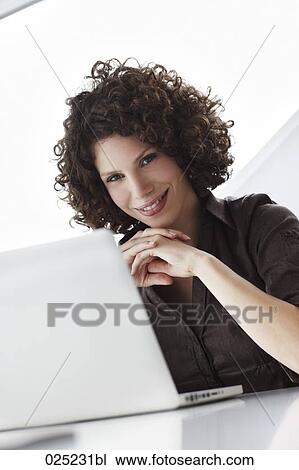 portrait of young businesswoman with laptop computer View Large Photo Image Stock Image - portrait of young businesswoman with laptop computer. Fotosearch