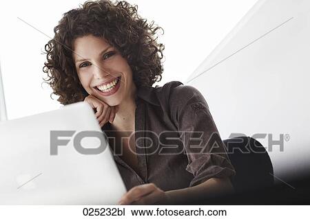portrait of young businesswoman with laptop computer View Large Photo Image Stock Image - portrait of young businesswoman with laptop computer. Fotosearch