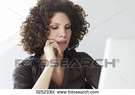Stock Image - portrait of young businesswoman with laptop computer. Fotosearch