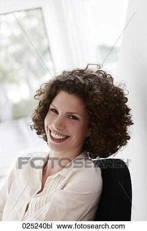 portrait of young woman wirh curly hair View Large Photo Image Stock Image - portrait of young woman wirh curly hair. Fotosearch