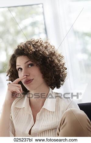 portrait of young woman with curly hair View Large Photo Image Stock Image - portrait of young woman with curly hair. Fotosearch