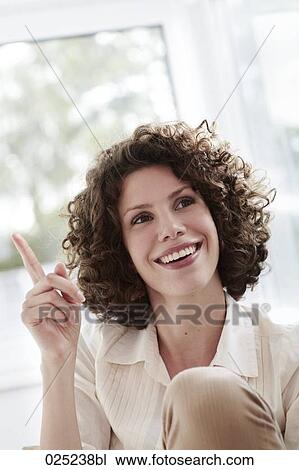 portrait of young woman with curly hair View Large Photo Image Stock Image - portrait of young woman with curly hair. Fotosearch