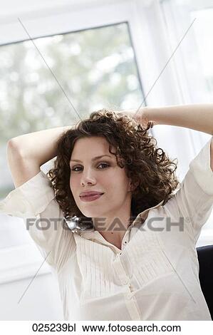 portrait of young woman with curly hair View Large Photo Image Stock Image - portrait of young woman with curly hair. Fotosearch
