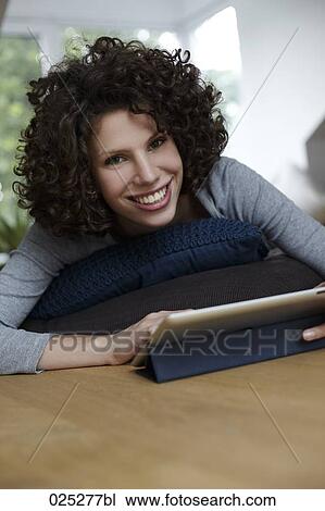 portrait of young woman with tablet computer View Large Photo Image Stock Image - portrait of young woman with tablet computer. Fotosearch