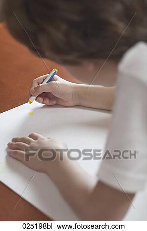 Stock Image - young boy drawing with crayon. Fotosearch