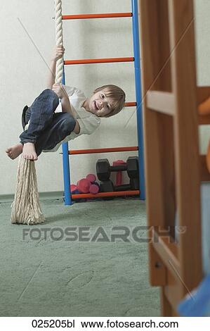 young boy playing at home View Large Photo Image Stock Image - young boy playing at home. Fotosearch
