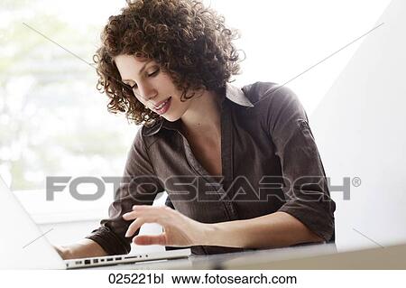 young businesswoman working with laptop computer View Large Photo Image Stock Image - young businesswoman working with laptop computer. Fotosearch
