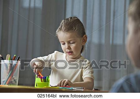 young girl and young boy doing handicraft together View Large Photo Image Stock Image - young girl and young boy doing handicraft together. Fotosearch