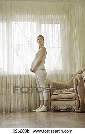 young pregnant woman at home View Large Photo Image Stock Image - young pregnant woman at home. Fotosearch