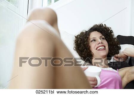 young woman with cup of coffee View Large Photo Image Stock Image - young woman with cup of coffee. Fotosearch