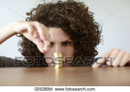 young woman with pile of coins View Large Photo Image Stock Image - young woman with pile of coins. Fotosearch