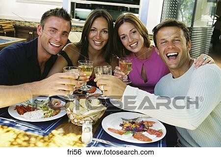 Stock Image - celebrating, bar, casual, cafe, bread, adults. Fotosearch - Search Stock Photography, Poster Photos, Pictures, and Photo Clip Art