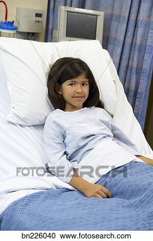 Girl Lying Down In Hospital Bed Stock Image Bn226040 Fotosearch