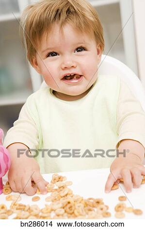 baby eating cereal