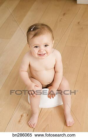 baby sitting on potty
