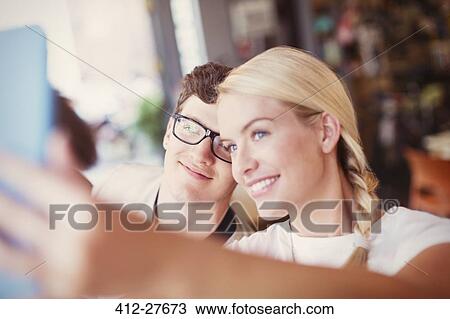 Stock Image - Couple taking selfie with digital tablet. Fotosearch