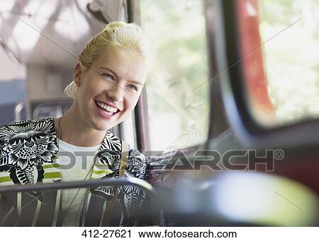 Enthusiastic woman riding bus View Large Photo Image Stock Image - Enthusiastic woman riding bus. Fotosearch