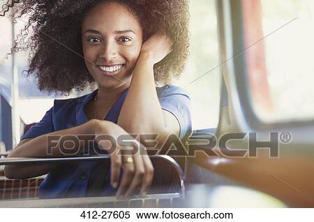 Portrait smiling woman riding bus View Large Photo Image Stock Photography - Portrait smiling woman riding bus. Fotosearch