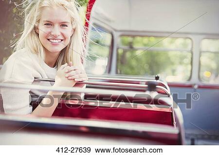 Portrait smiling woman riding double-decker bus View Large Photo Image Stock Photo - Portrait smiling woman riding double-decker bus. Fotosearch