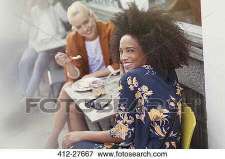 Portrait smiling woman with friend at sidewalk cafe View Large Photo Image Stock Photo - Portrait smiling woman with friend at sidewalk cafe. Fotosearch