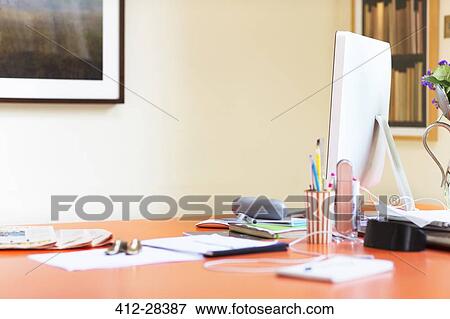 Computer and paperwork on desk in home office View Large Photo Image Stock Photo - Computer and paperwork on desk in home office. Fotosearch