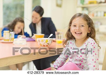 Portrait enthusiastic girl at breakfast table View Large Photo Image Stock Photo - Portrait enthusiastic girl at breakfast table. Fotosearch