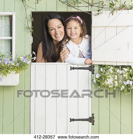 Portrait smiling mother and daughter in playhouse window View Large Photo Image Stock Photo - Portrait smiling mother and daughter in playhouse window. Fotosearch