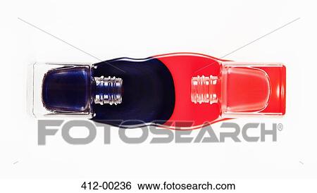 Blue and coral fingernail polish spilling from bottles View Large Photo Image Stock Photograph - Blue and coral fingernail polish spilling from bottles. Fotosearch