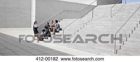 Business people meeting on concrete steps View Large Photo Image Stock Image - Business people meeting on concrete steps. Fotosearch
