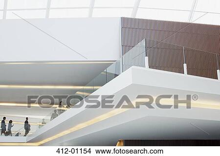 Business people with suitcases on elevated walkway View Large Photo Image Picture - Business people with suitcases on elevated walkway. Fotosearch