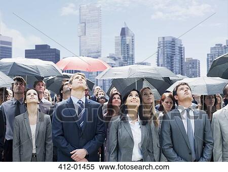 Business people with umbrellas looking up View Large Photo Image Stock Photography - Business people with umbrellas looking up. Fotosearch