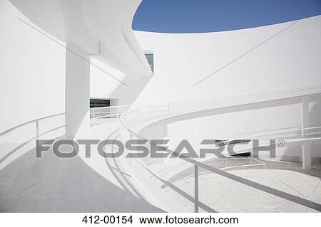 Businessman ascending curving elevated walkway View Large Photo Image Picture - Businessman ascending curving elevated walkway. Fotosearch