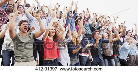 Cheering fans in crowd View Large Photo Image Stock Photo - Cheering fans in crowd. Fotosearch