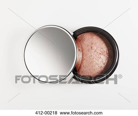 Stock Photo - Close up of blush in jar. Fotosearch