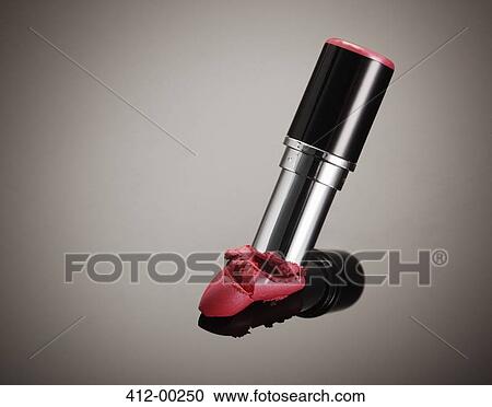 Stock Image - Close up of crushed tip of pink lipstick. Fotosearch