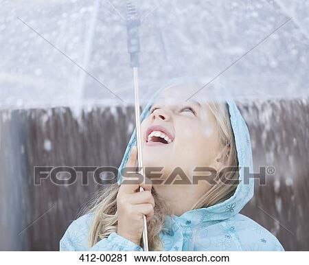 Close up of girl under umbrella looking up at downpour View Large Photo Image Stock Image - Close up of girl under umbrella looking up at downpour. Fotosearch