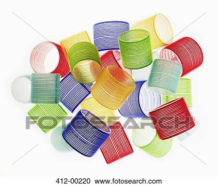 Stock Image - Close up of multicolor hair curlers. Fotosearch